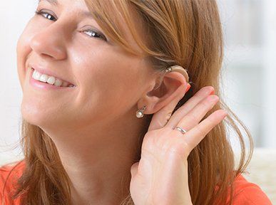 VT Hearing — Smiling Girl With Hearing Aid in Shelburne, VT VT Hearing — Smiling Girl With Hearing Aid in Shelburne, VT