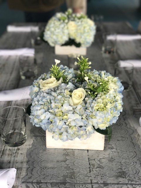 A table with blue and white flowers on it