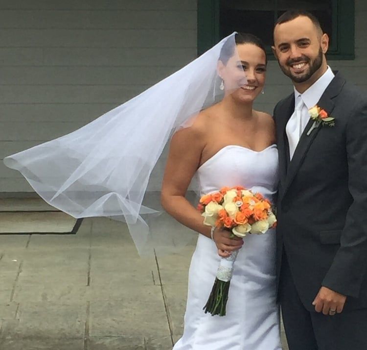 Married Couple With an Orange Bouquet