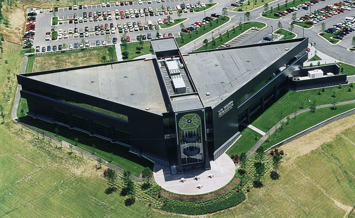 An aerial view of a large triangle shaped building
