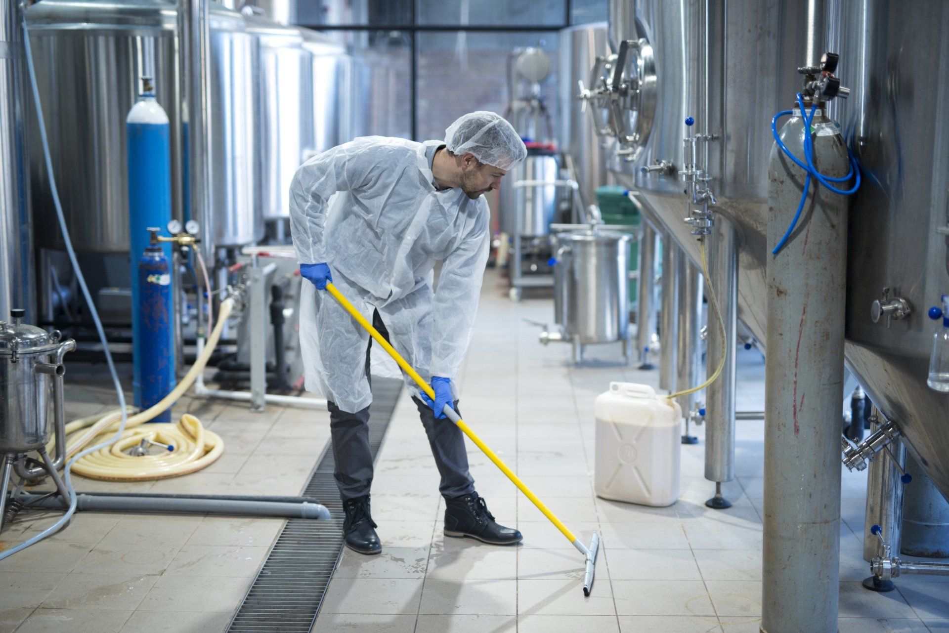 professional team cleaning and moping the area