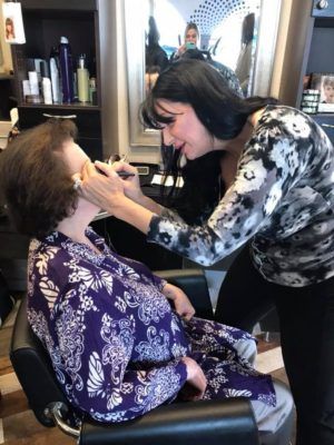 Woman Doing a Makeup to Customer — Scottsdale, AZ — XanderLyn Salon Woman Doing a Makeup to Customer — Scottsdale, AZ — XanderLyn Salon