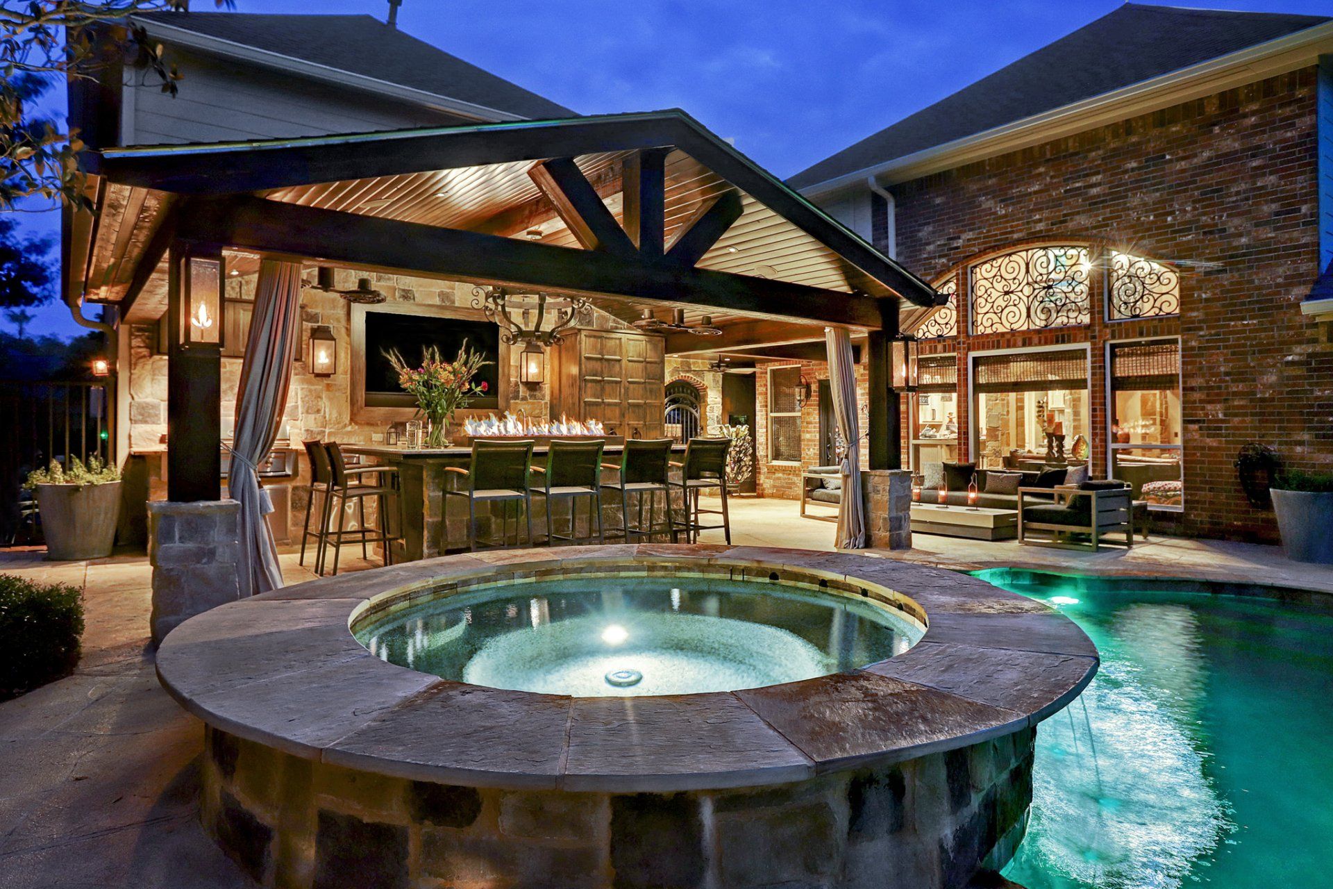 pool next to outdoor kitchen
