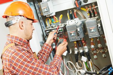 commercial electrician fixing breaker