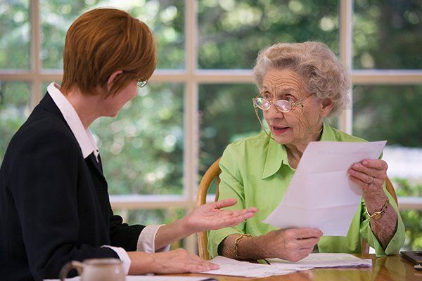 Senior Woman Meeting with Lawyer — Fort Walton Beach, FL — Tracy O. Strom, PA Senior Woman Meeting with Lawyer — Fort Walton Beach, FL — Tracy O. Strom, PA