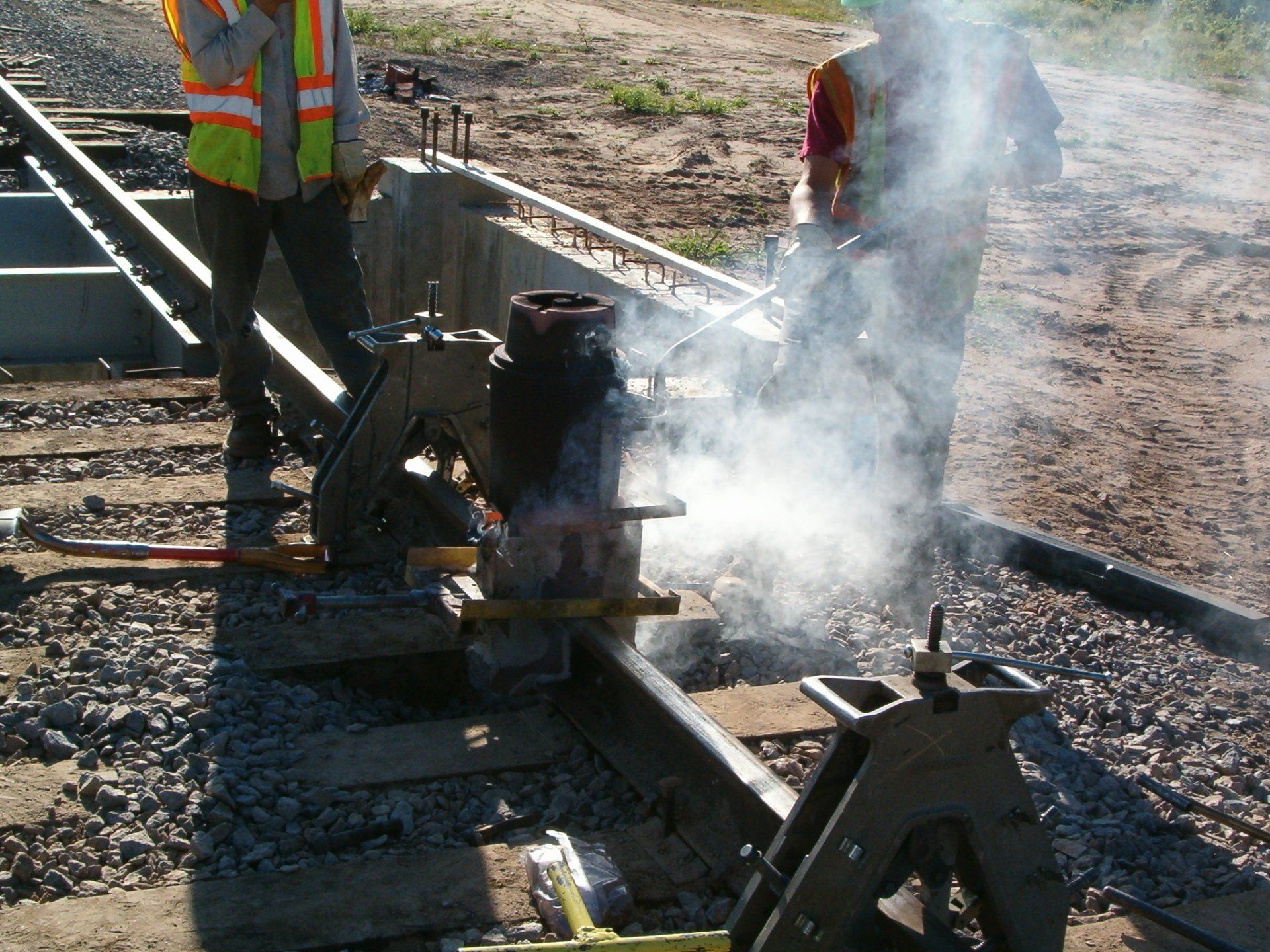 Workers Repairing the Railroad — Menomonee Falls, WI — Volkmann Railroad Builders