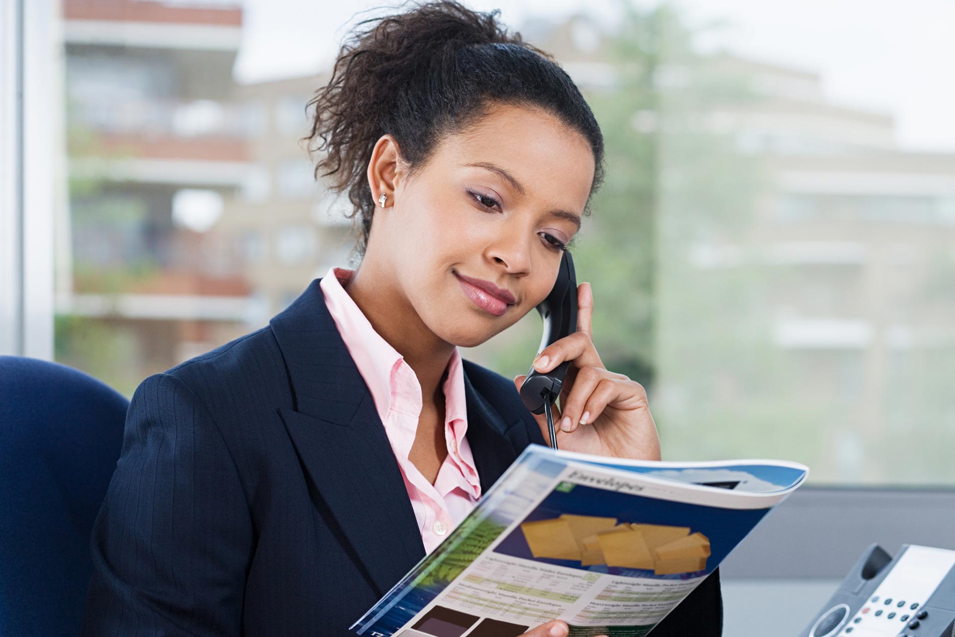 Business Woman Reading Brochure — Davie, FL — Fine Line Printing