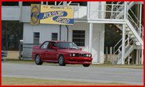Mini Cooper — Red Car Having Test Drive On the Road In Jacksonville, Fl