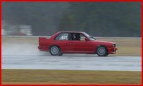 Car Service — Red Car Having Test Drive On the Road In Jacksonville, Fl
