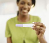 Woman checking pregnancy test