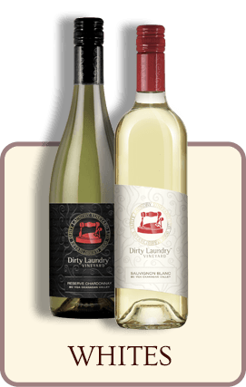 Two bottles of white wine are sitting next to each other on a table.