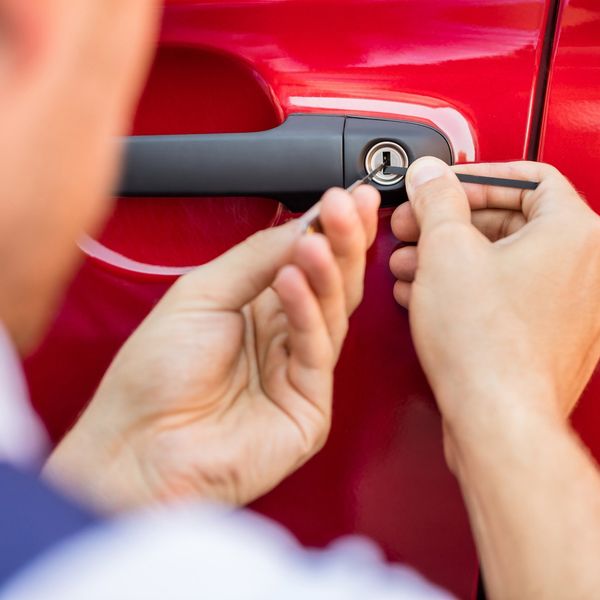 Man Unlocking the Car Door — Dallas, TX — Locksmith Man Unlocking the Car Door — Dallas, TX — Locksmith
