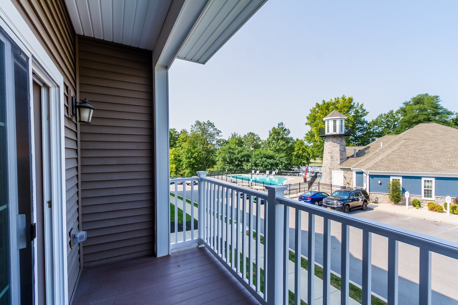 Balcony overlooking leasing office and outdoor pool