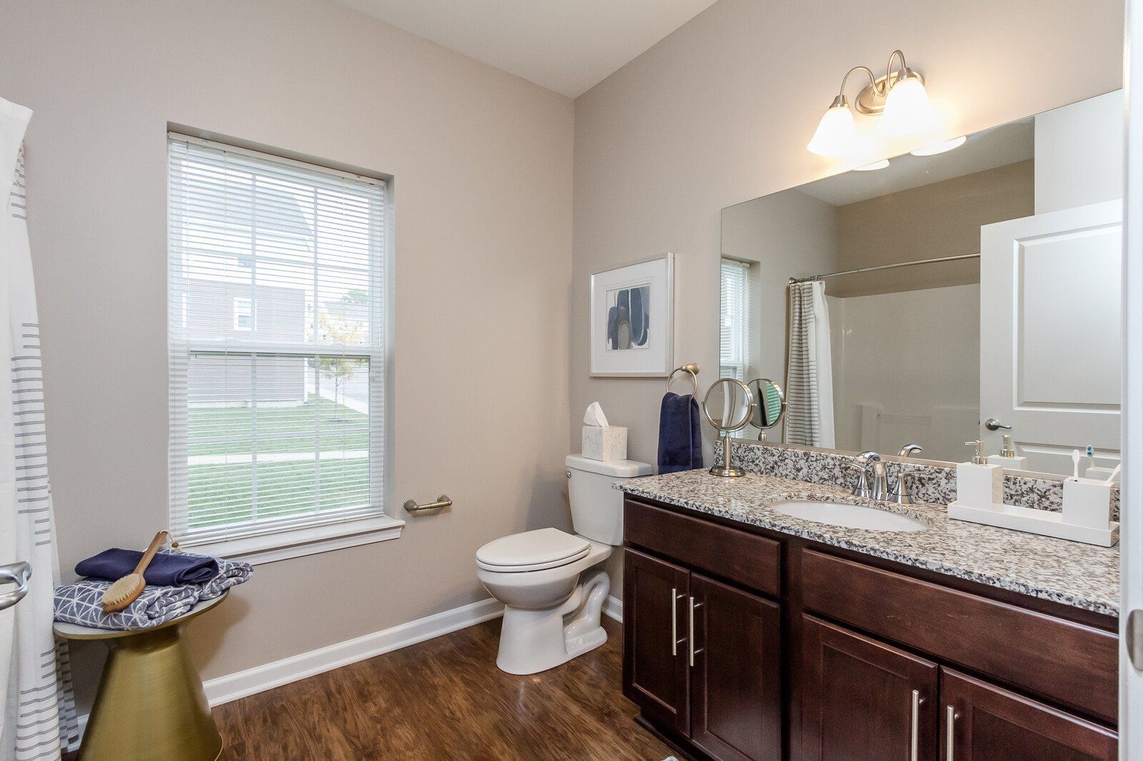Bathroom with hardwood floors and granite countertops