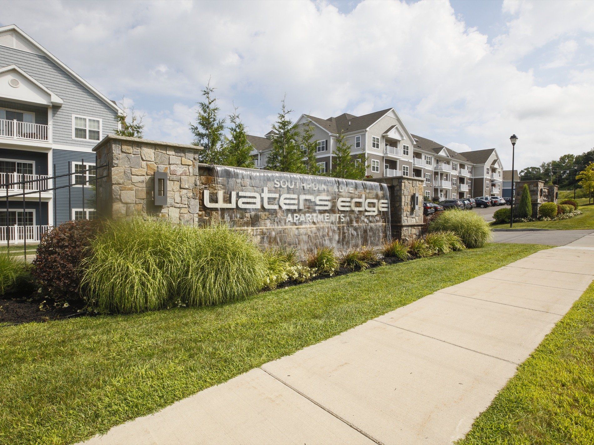 Waters Edge entrance with waterfall sign