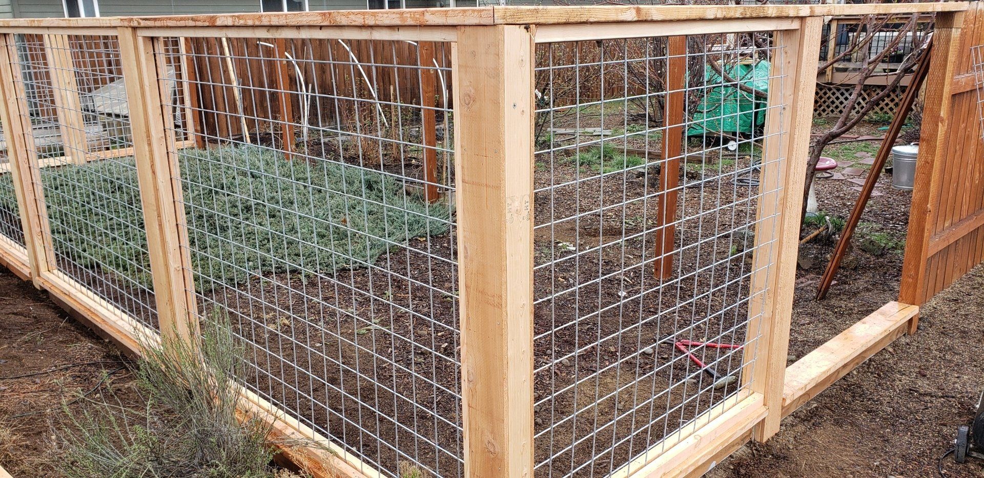Wood fence framing structure during installation process