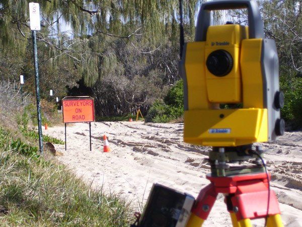 surveying on dirt road