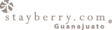 Logotipo de Stayberry.com con un icono de una flor y el texto “Guam”.