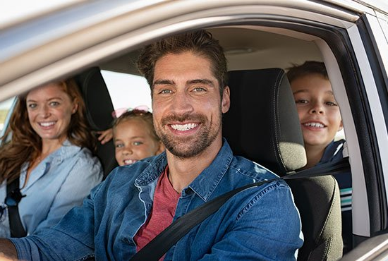 Happy Family Inside Car — Ogdensburg, NY — Truax Insurance Agency Inc. Happy Family Inside Car — Ogdensburg, NY — Truax Insurance Agency Inc.
