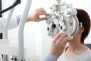 Contact Lenses — Woman Doing Eyesight Measurement in Joliet, IL Contact Lenses — Woman Doing Eyesight Measurement in Joliet, IL