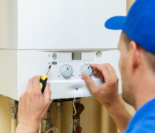 man checking water heater