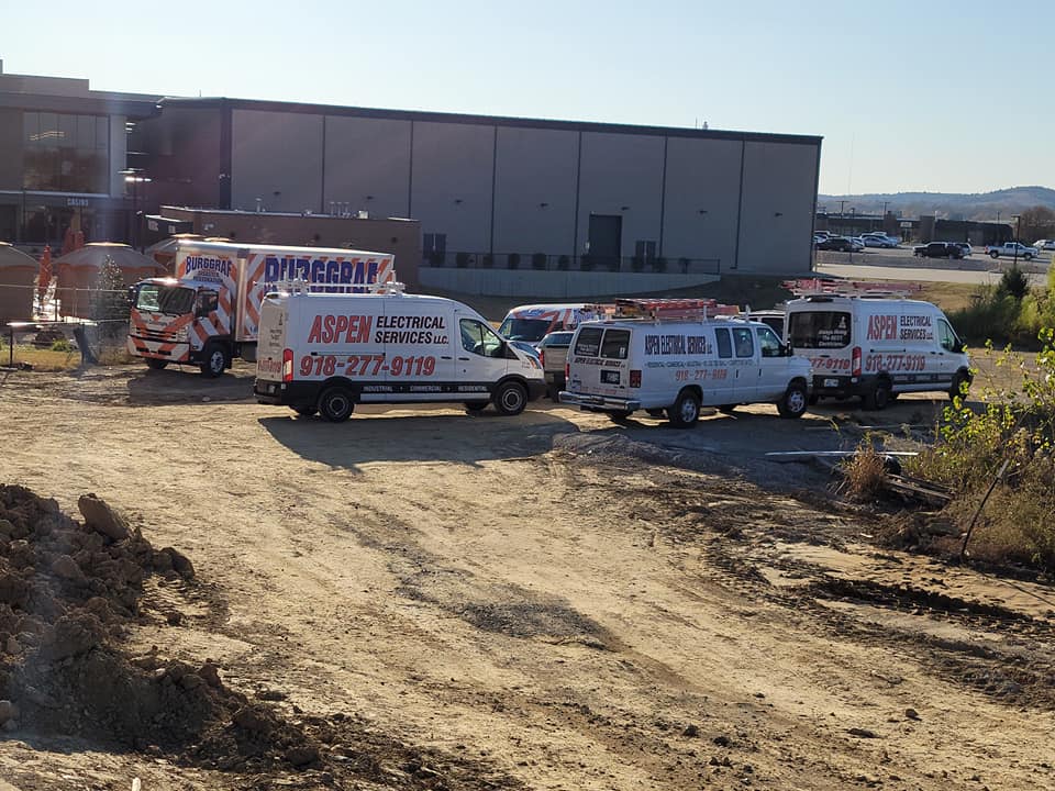 Company vehicles by a building