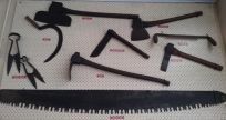 assortment of saws and axes