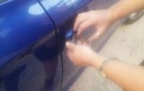 hands trying to open car door
