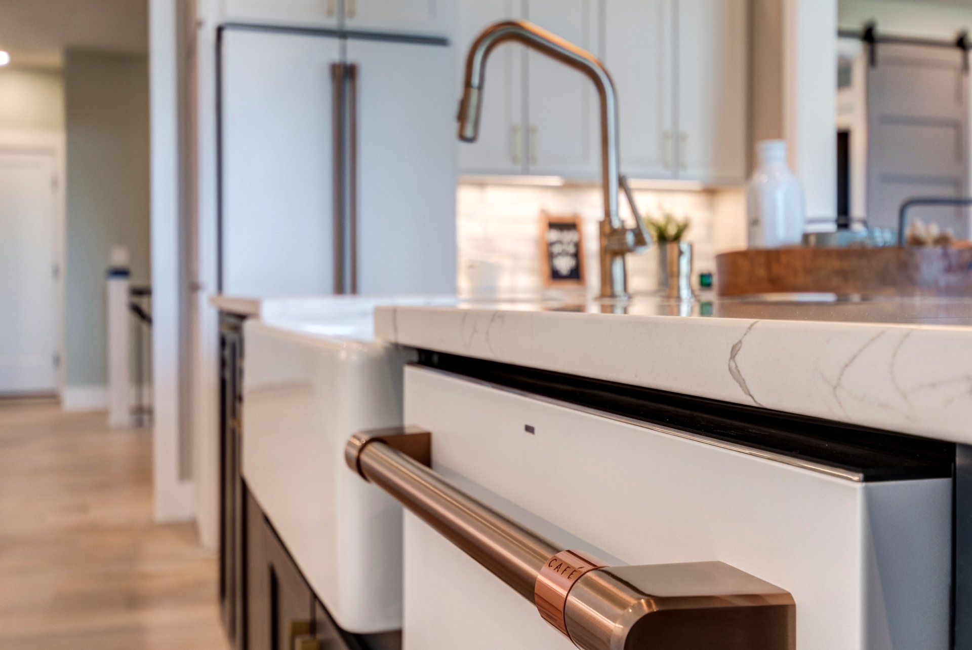farmhouse sink and dishwasher under island