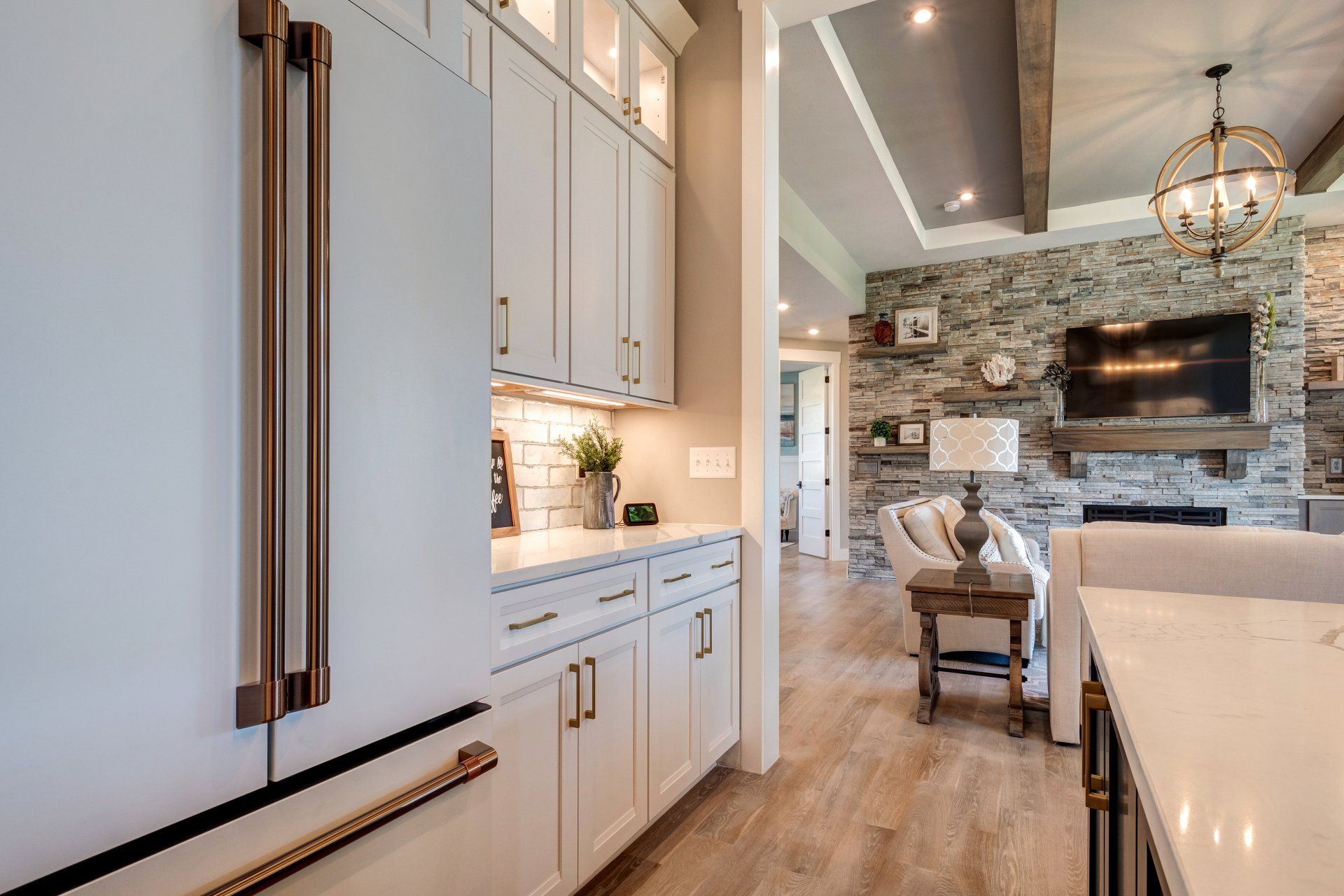 White kitchen with living room in background