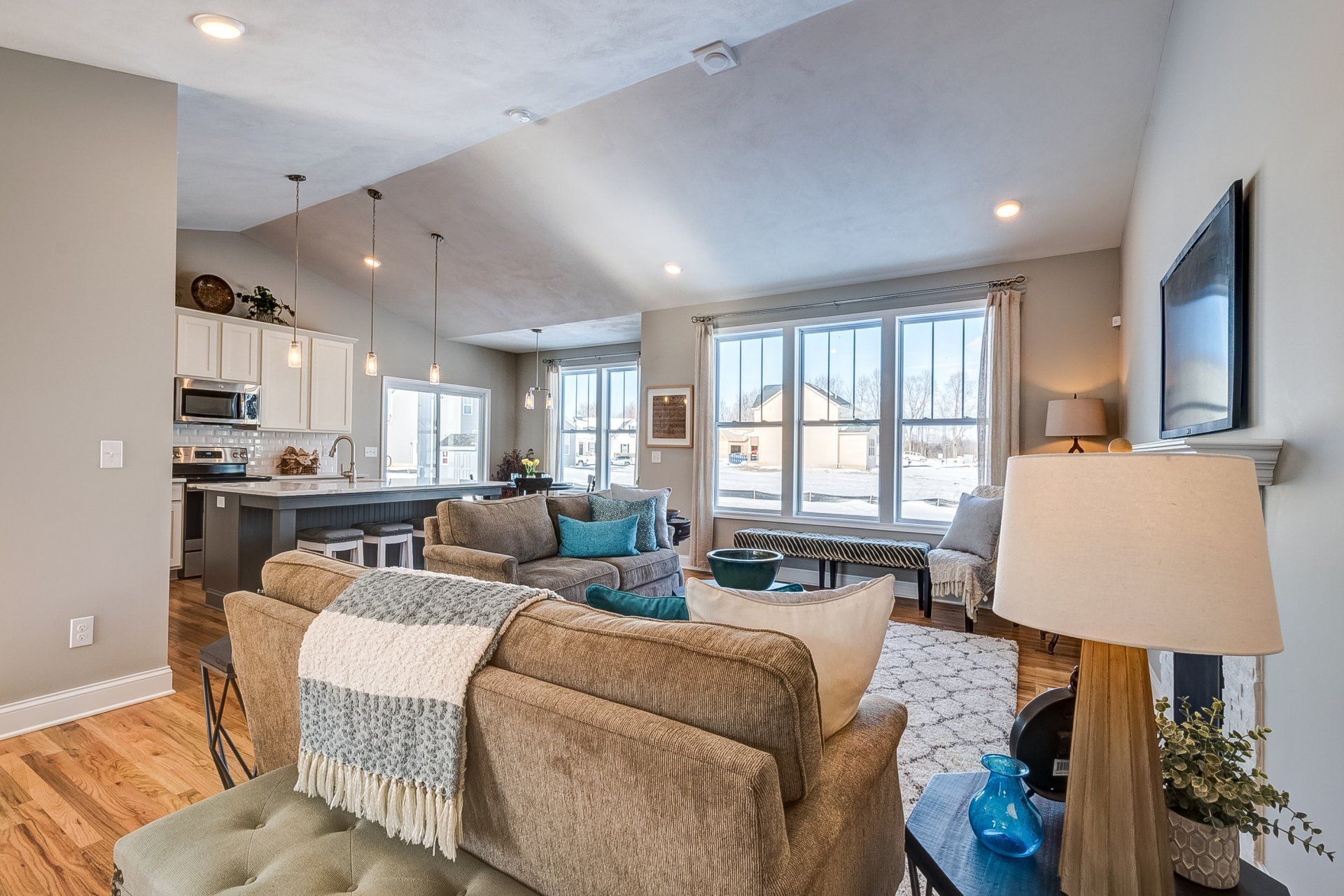 living room and kitchen with vaulted ceilings