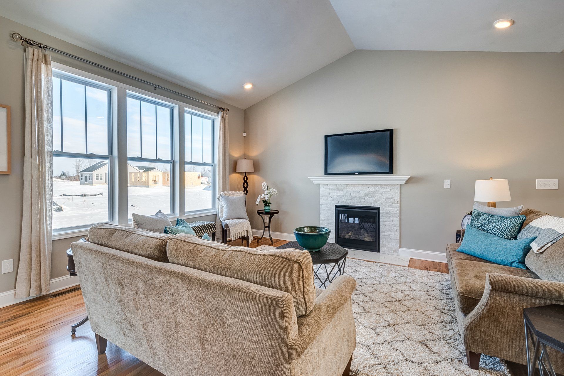 living room with windows facing backyard