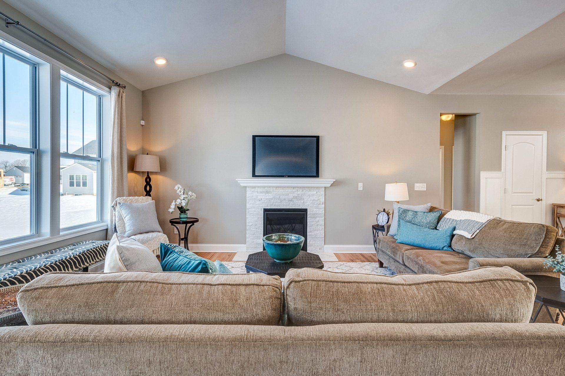 living room with fireplace and vaulted ceiling