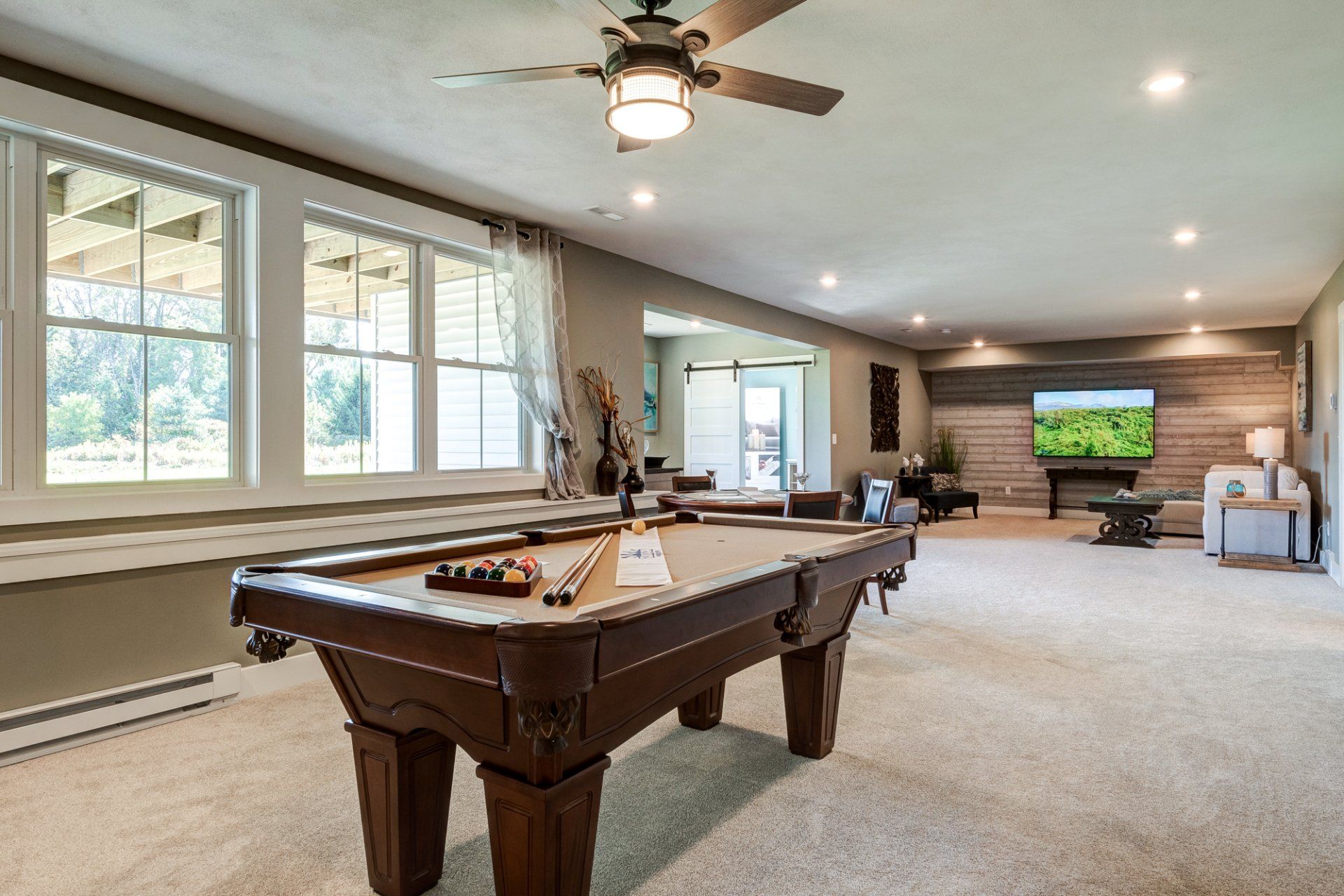 flex room with poker table and living area