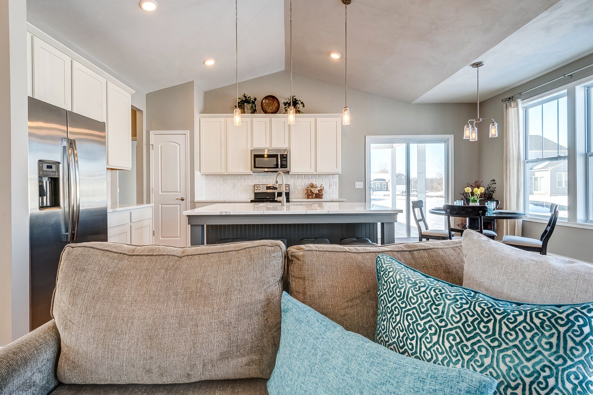 couch with kitchen in background