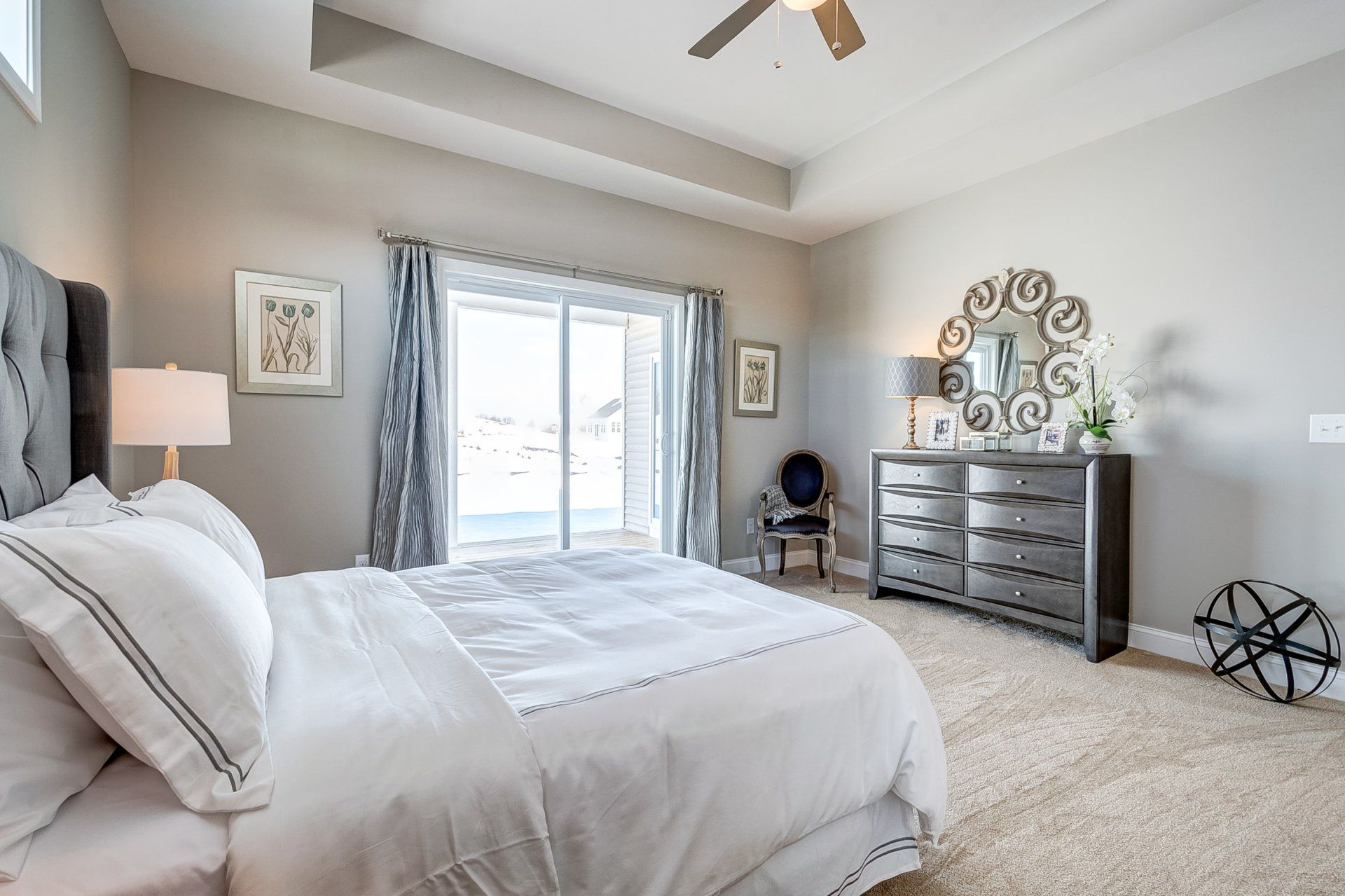 primary bedroom with recessed ceiling