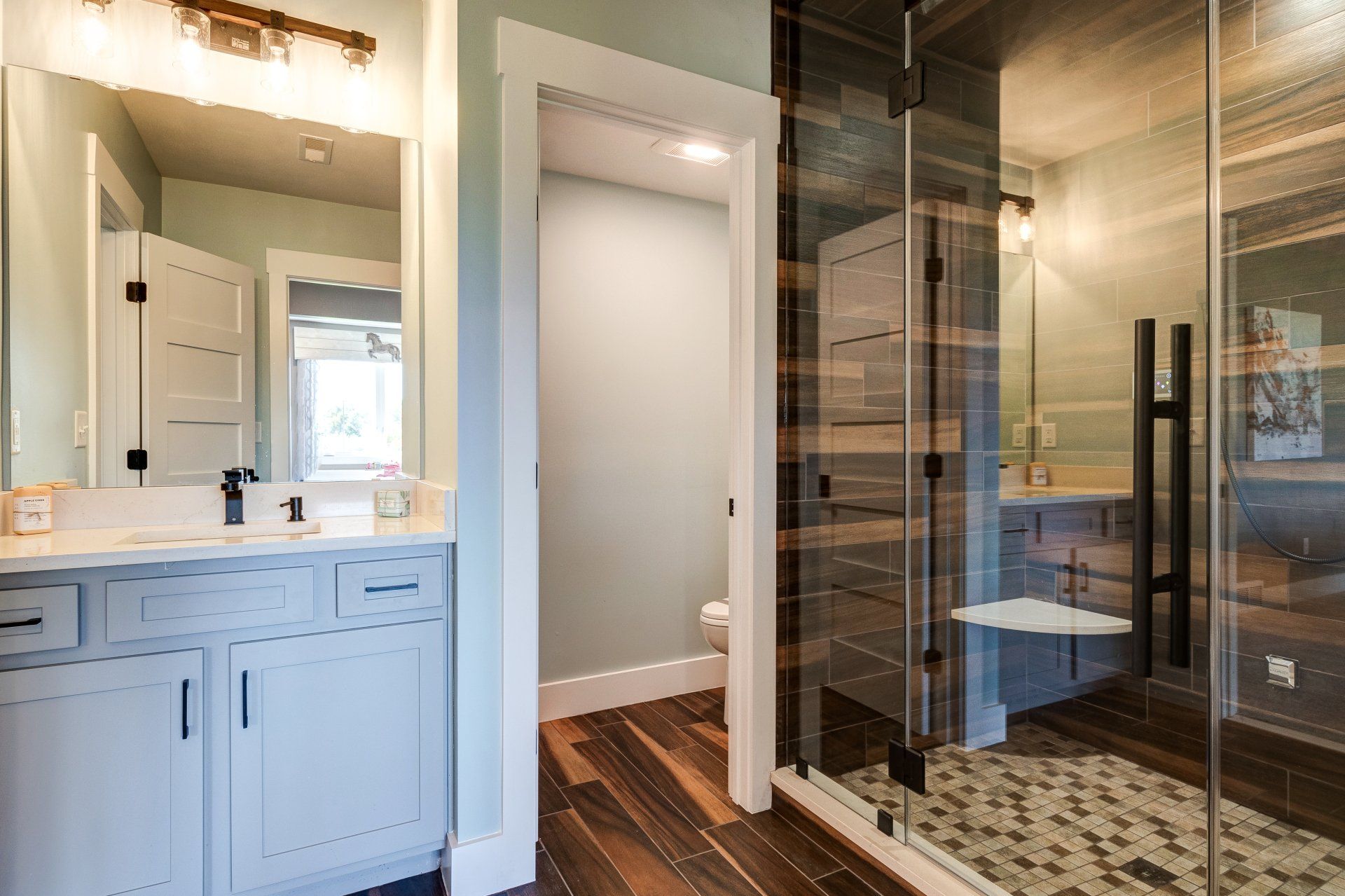 bathroom vanity and tile and tile shower