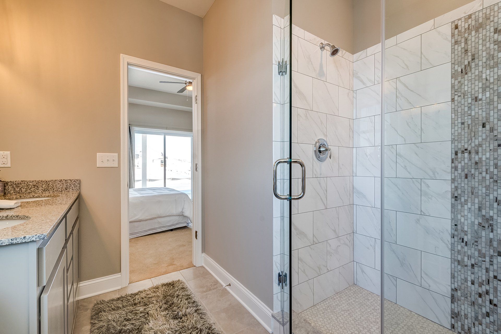 primary bathroom with tile shower