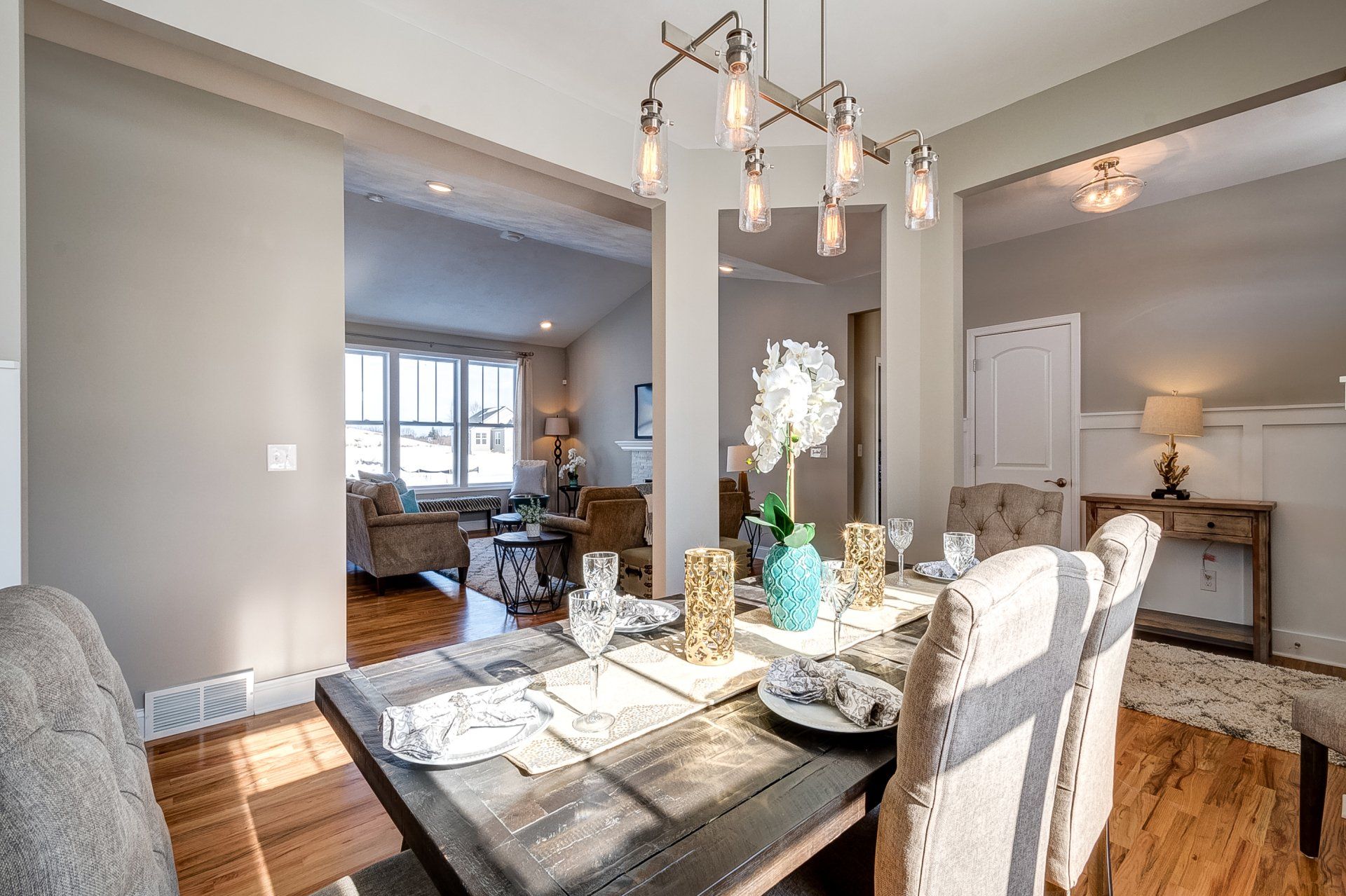 light fixture above 6 person dining room set with bench
