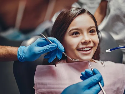 Cute Girl in Dental Clinic — McAllen, TX — Dr. Joey Cazares & Associates Cute Girl in Dental Clinic — McAllen, TX — Dr. Joey Cazares & Associates