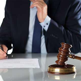 Portrait of A Man Holding Pen and Signing Document — Local Attorneys in San Jose, CA Portrait of A Man Holding Pen and Signing Document — Local Attorneys in San Jose, CA