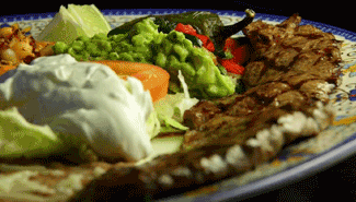 Grilled steak with guacamole, sour cream, and other Mexican sides. restaurants near me that deliver, RPSJC 92675