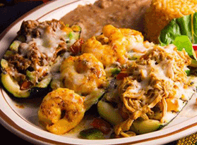 Plate of stuffed squash with melted cheese, rice, and beans.  best mexican restaurants