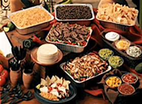 A spread of Mexican food: fajitas, sides, chips, and dips.  best mexican restaurants near me | catering