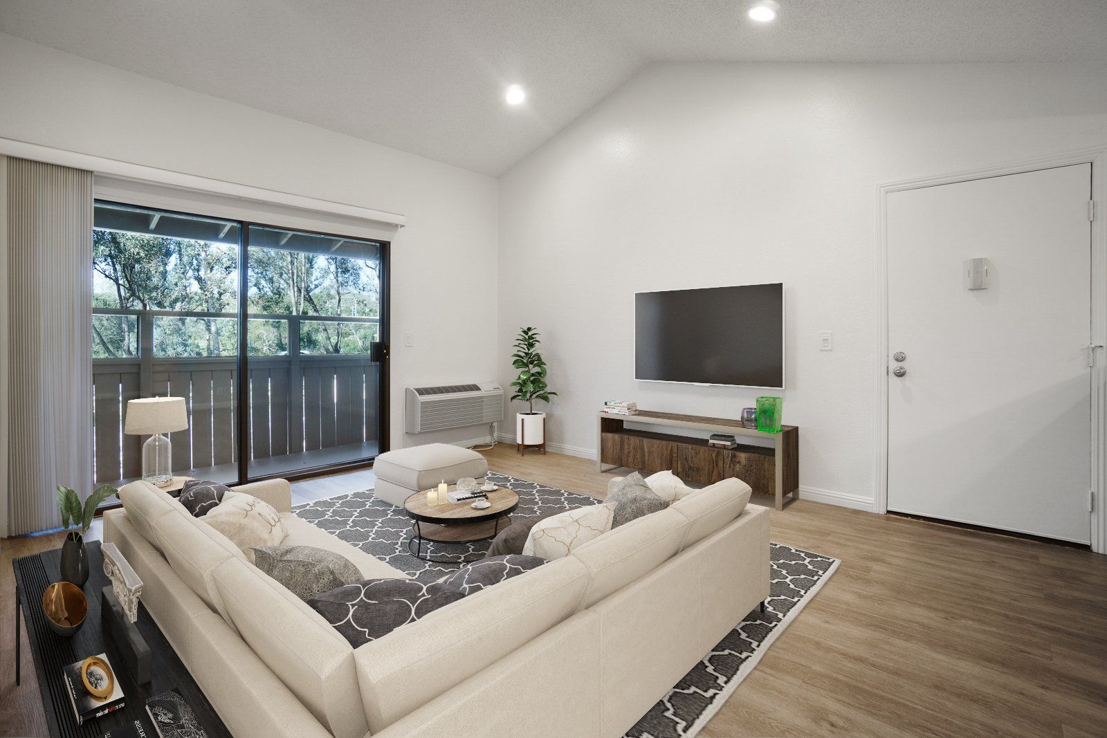 Staged living room with sofa and TV
