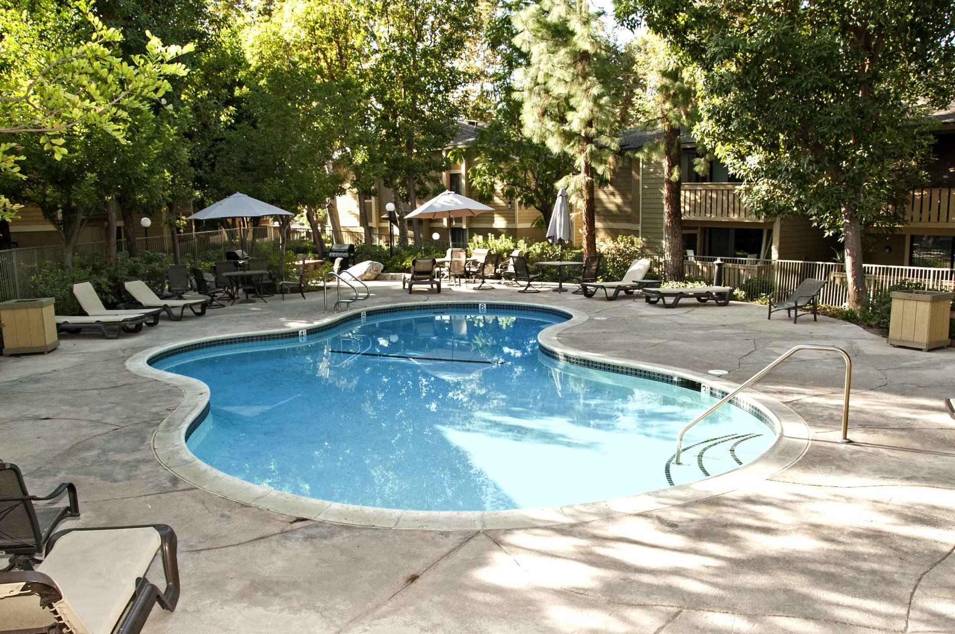 Pool and deck area with tables and chairs