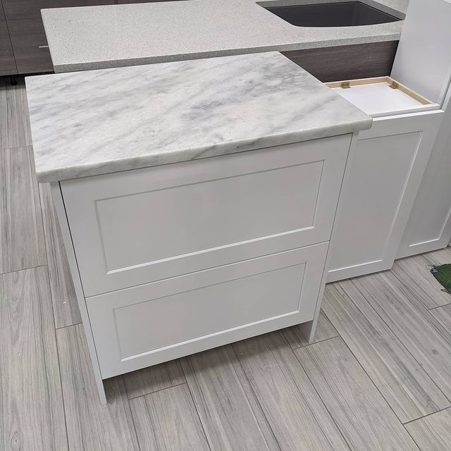 Granite Table with Drawer ─ Sarasota, FL ─ Falfas Cabinets & Stone LLC