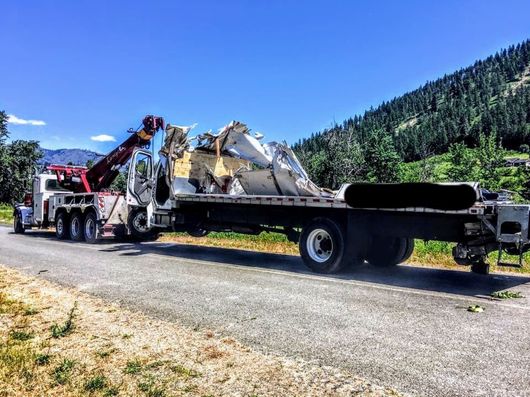 Towing Blue Truck — Okanogan, WA — Randy’s Auto Parts & Towing Towing Blue Truck — Okanogan, WA — Randy’s Auto Parts & Towing