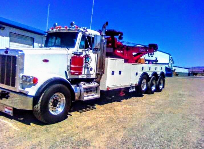 Green Towing Trucks — Okanogan, WA — Randy’s Auto Parts & Towing Green Towing Trucks — Okanogan, WA — Randy’s Auto Parts & Towing