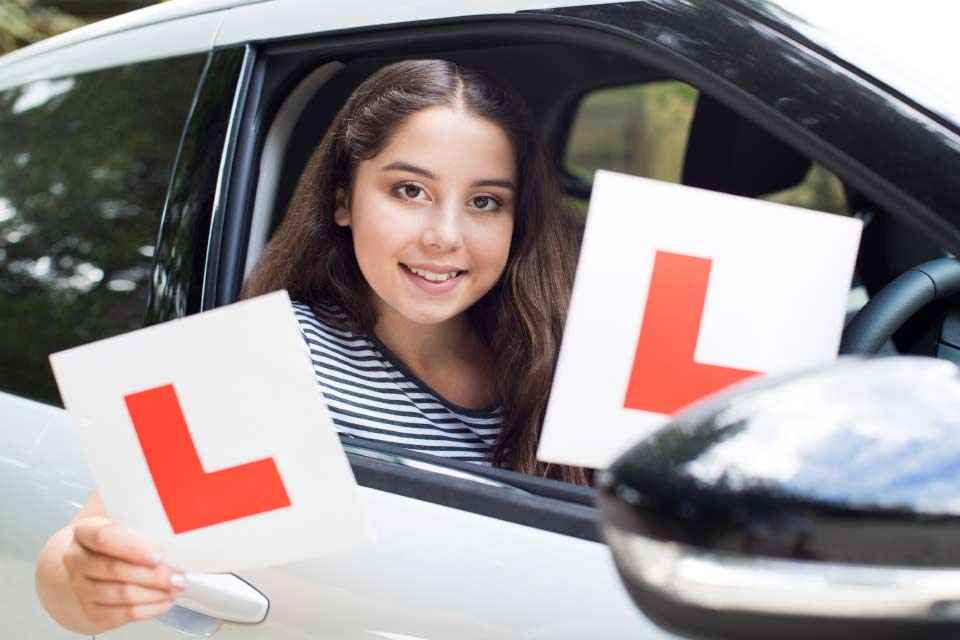 woman holding leaner sign